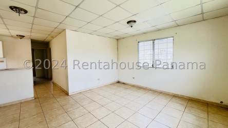 Simple kitchen space with tiled floor and cabinets in Quintas el Pacífico La Chorrera house for sale