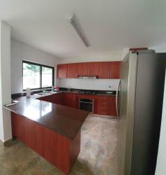 Bright spacious living and dining area with windows in house Puerto Madero Costa Verde Panama