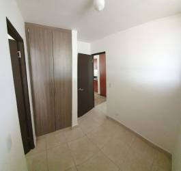 Spacious kitchen with granite tops, brown cabinetry, large window PH Puerto Madero Costa Verde Panama