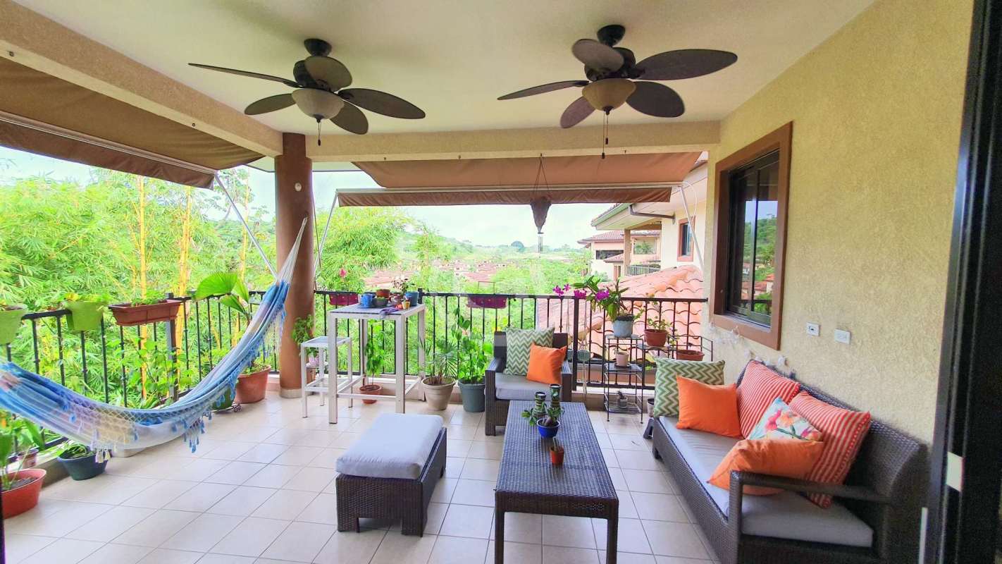 Covered tropical balcony with hammock ceiling fans lush view Embassy Club Clayton Panama