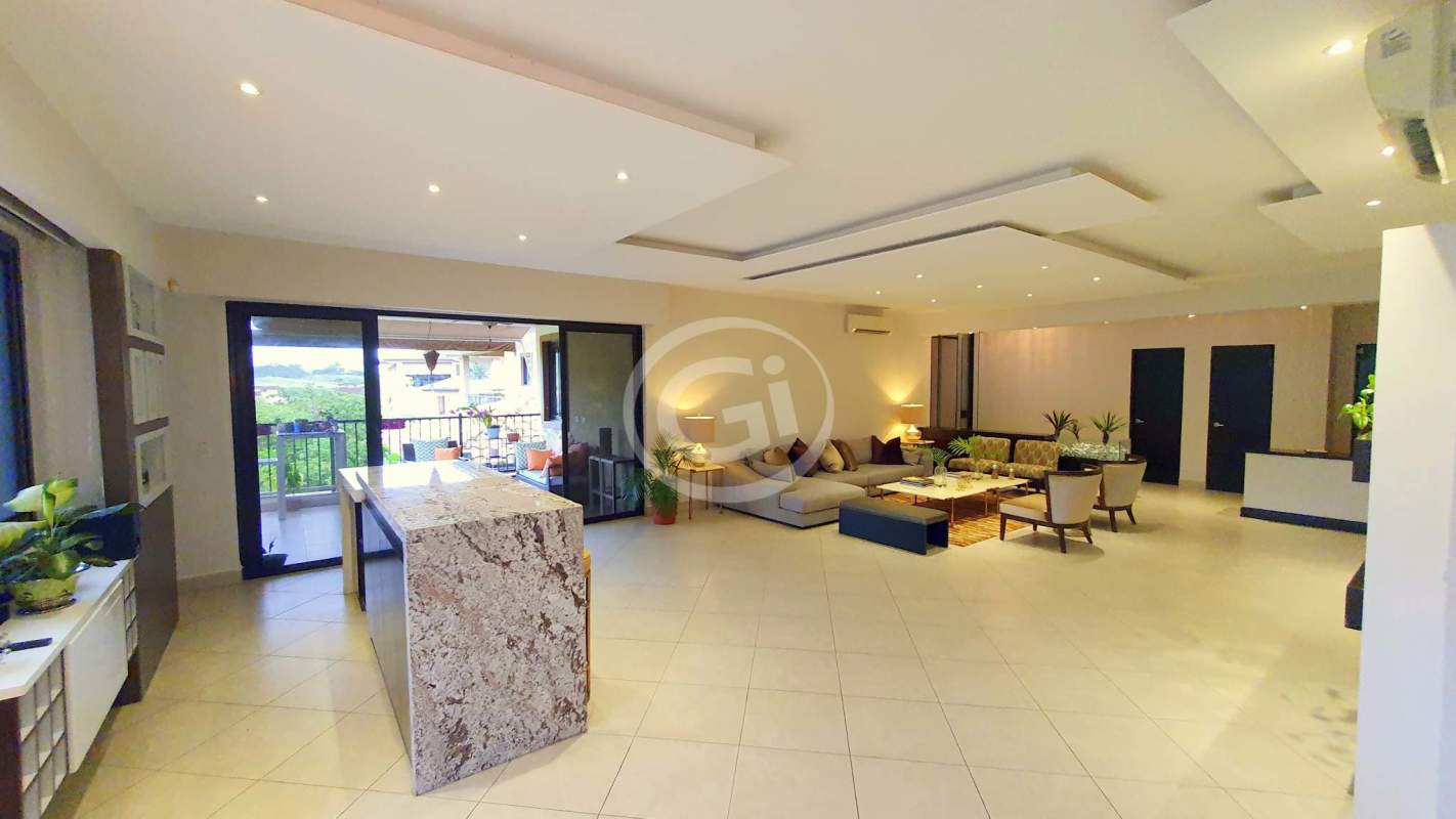 Spacious open-plan kitchen with granite island and balcony luxury penthouse Embassy Club Panama