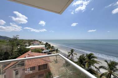 Contemporary kitchen with granite countertops, wood cabinets, stainless appliances PH Malibu Tower beach condo