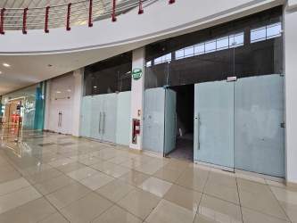 Empty retail unit with large glass facade inside Wesland Mall Arraiján Panama