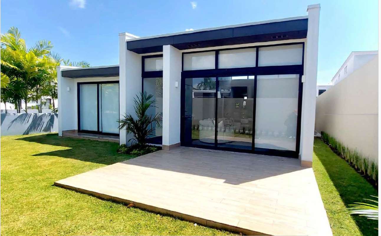 Open-concept living room with large windows and dining PH Barrio Alto Altos de Panamá