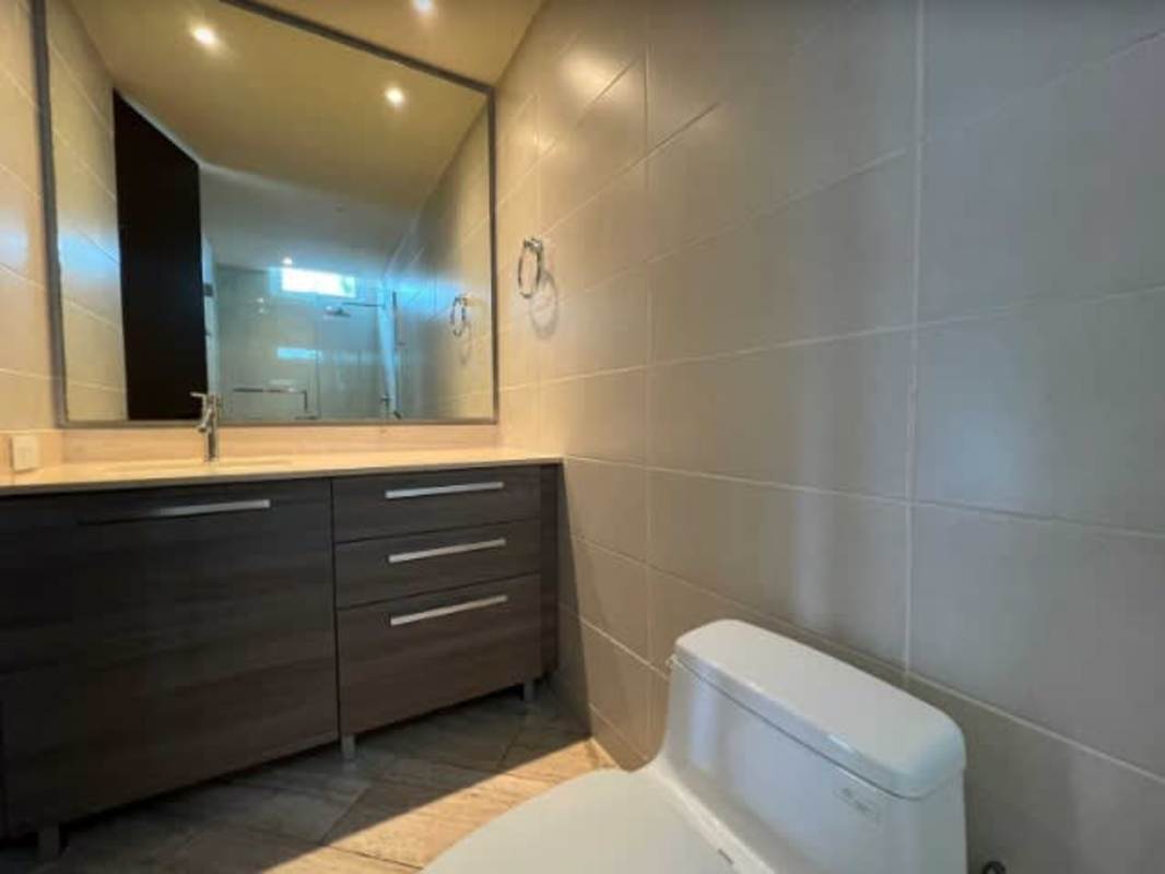 Spacious furnished bedroom with large bed and AC at PH The Regent Costa del Este Panama City