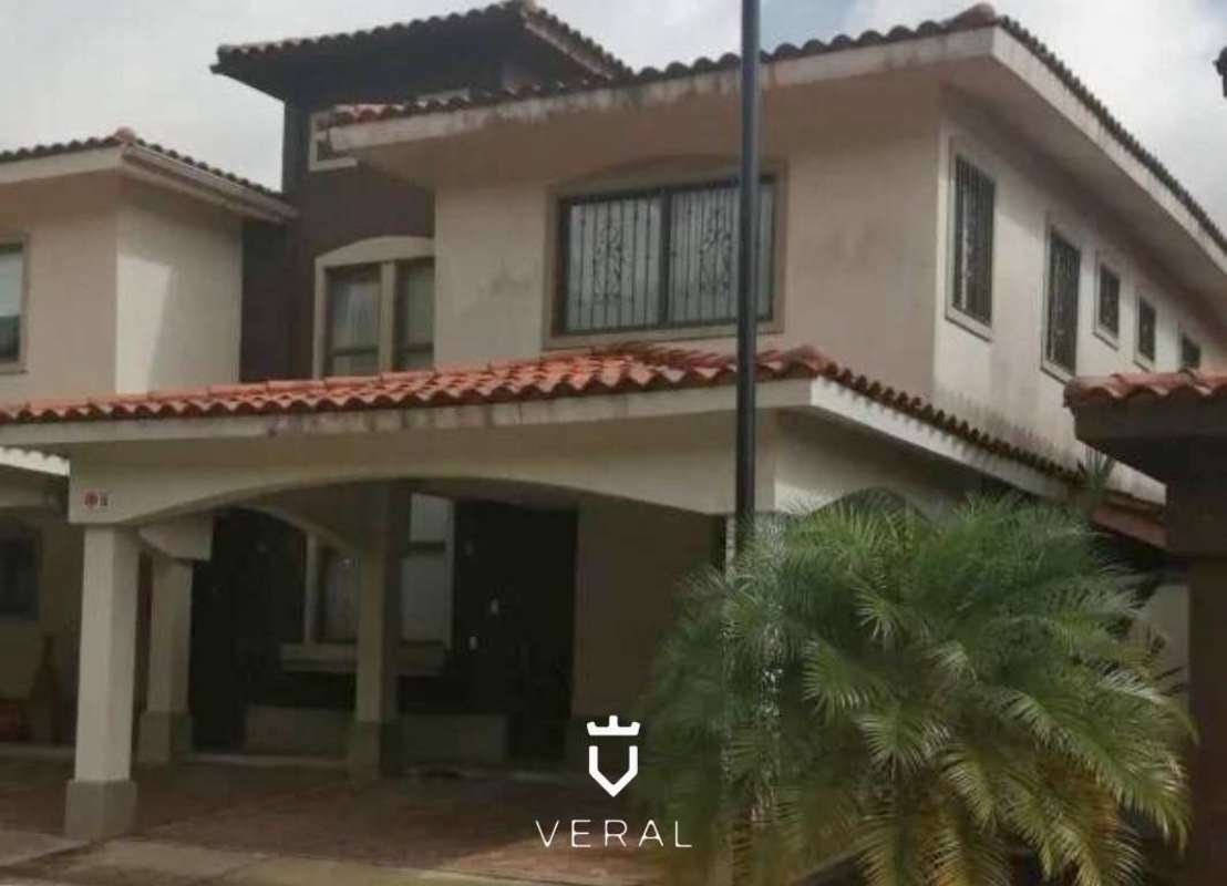 Mediterranean-inspired two-story house with red roof and covered carport at Green Village Milla 8 Panama