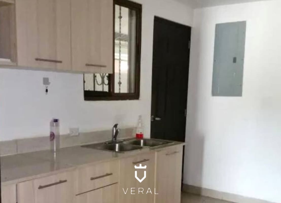 Fenced backyard with covered patio, grill area and ceiling fans at Green Village house Milla 8 Panama