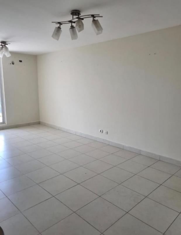 Living room with balcony access bright space PH Torres de Cantabria Don Bosco Panama City