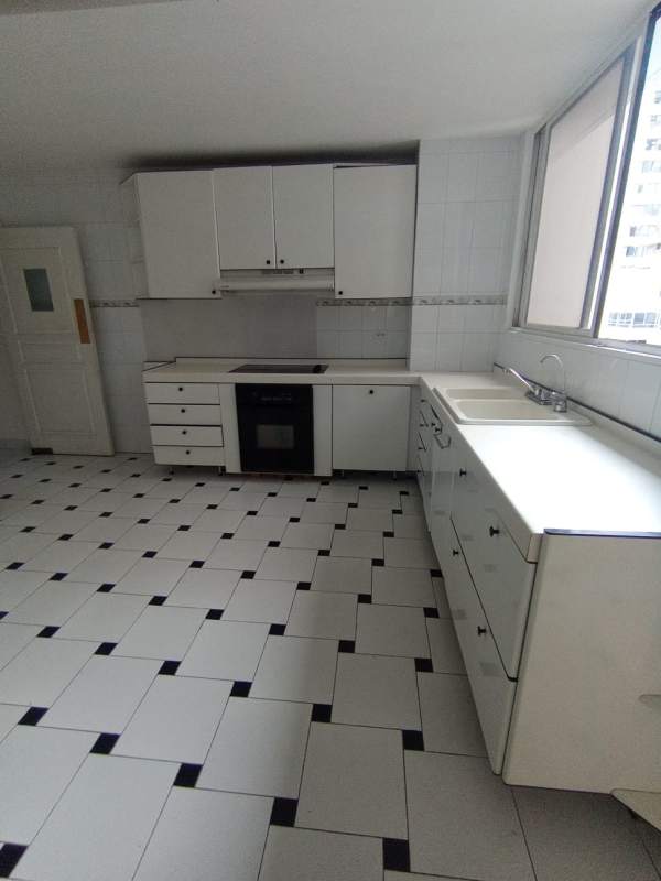 White contemporary kitchen with tile backsplash in PH Marina Mar Marbella Panama City