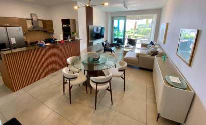 Modern open plan living dining and kitchen with patio access ocean views Rio Mar Residences Panama