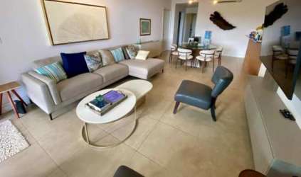 Bright modern living dining space with open kitchen Rio Mar beachfront condo Panama