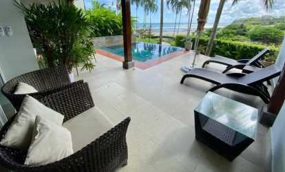 Covered terrace with lounge chairs private pool ocean view in Rio Mar Residences Panama
