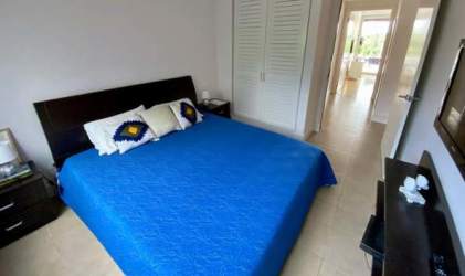 Spacious blue-themed bedroom with closets Rio Mar luxury beachfront flat Panama