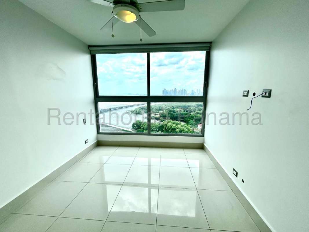 Spacious master bedroom with large windows and ocean views in Costa del Este Panama
