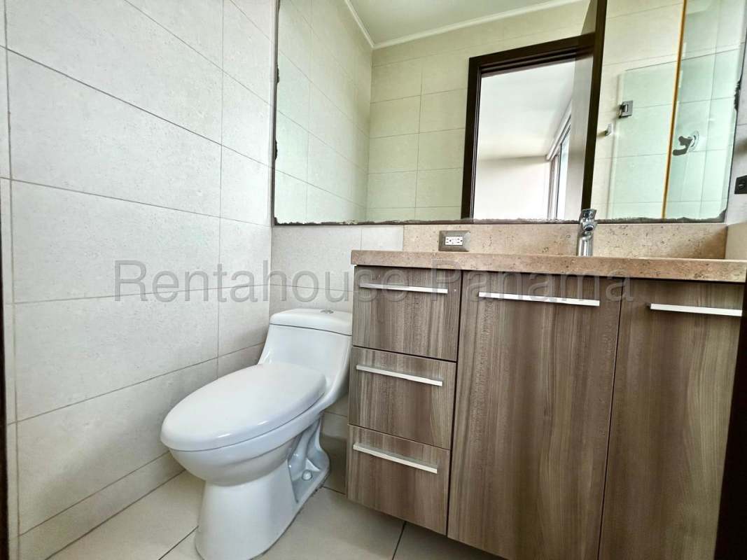 Elegant bathroom with glass shower and contemporary finishes in Costa del Este luxury apartment