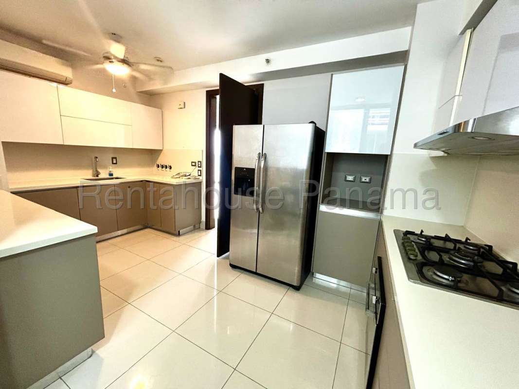 Bright modern living area with balcony access and ocean views in Costa del Mar Panama City