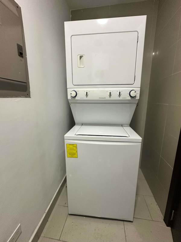 Kitchen with granite countertops, stainless refrigerator and appliances in PH Grand Tower Panama