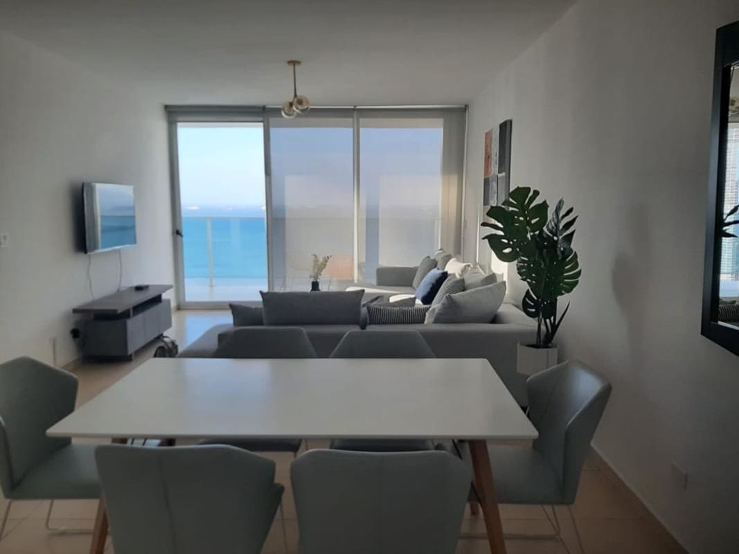 Secondary bedroom with floor-to-ceiling ocean view windows PH Waters Panama