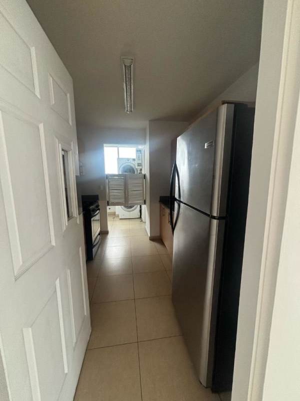 Modern narrow kitchen with tile flooring and appliances PH Sol del Este Costa del Este Panama