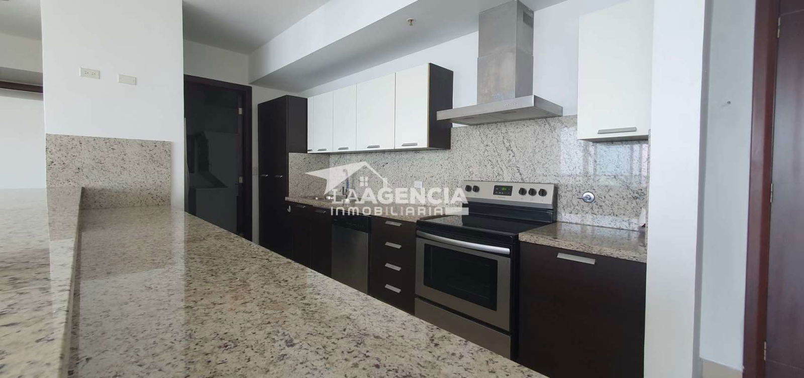 Sleek modern bathroom with glass shower enclosure, vanity in Punta Pacifica condo