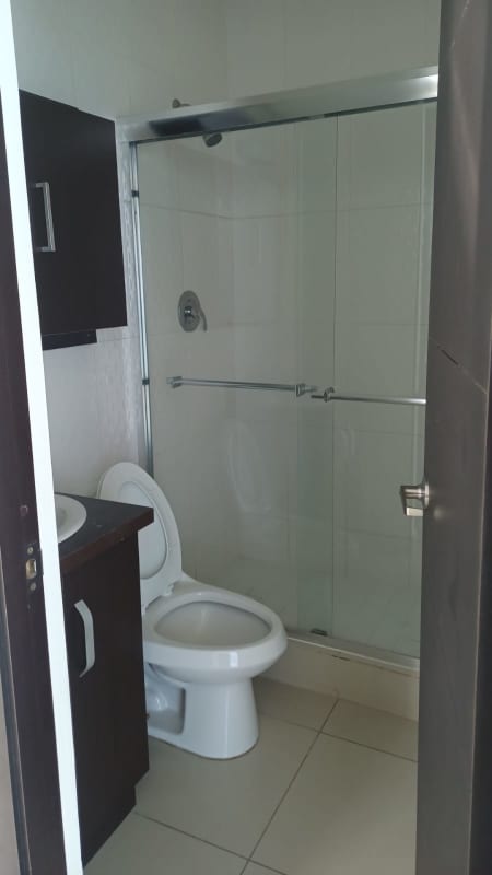 Bedroom with floor-to-ceiling windows, ocean view, built-in closet in PH Waterfalls Panama