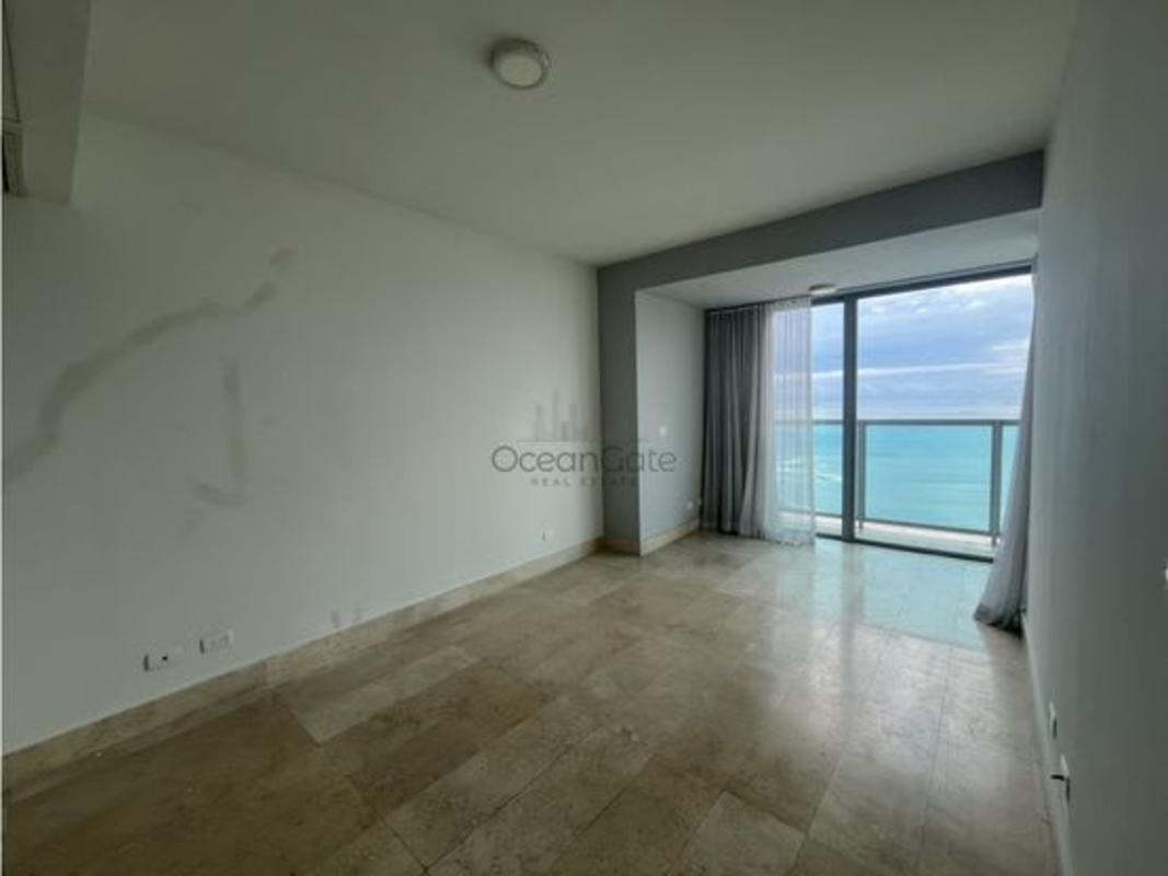 Large master bedroom with ocean view windows at PH Yoo Panama on Avenida Balboa