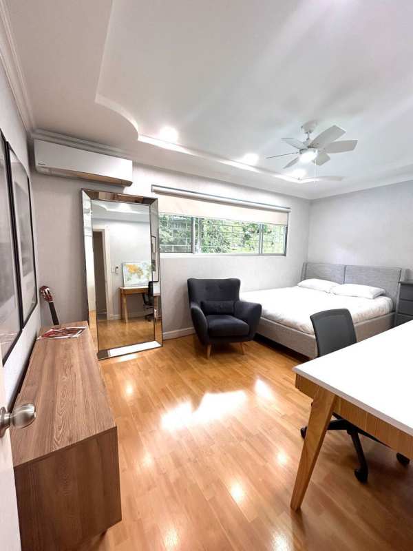 Bedroom with wood floors, ceiling fan, AC and large window in Cardenas Clayton Panama for rent