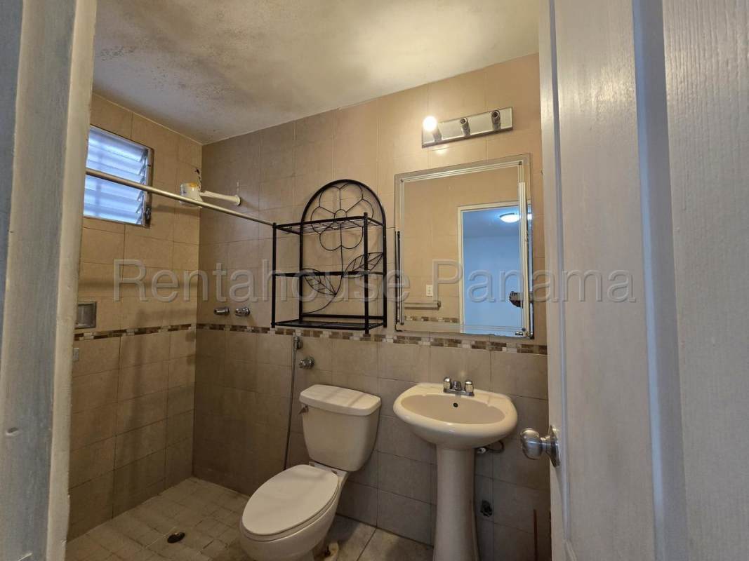 Kitchen with granite counters, cabinets and ceramic tile in Brisas del Golf Panama City