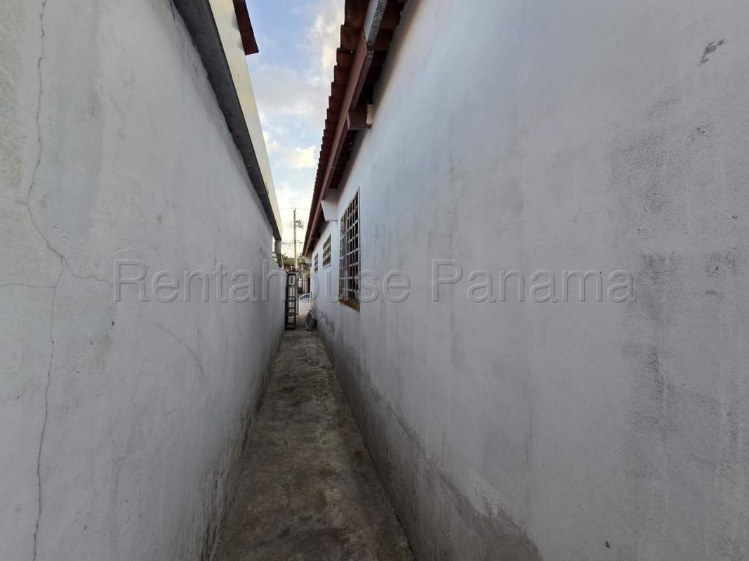 Covered backyard terrace and enclosed yard in Brisas del Golf Panama City