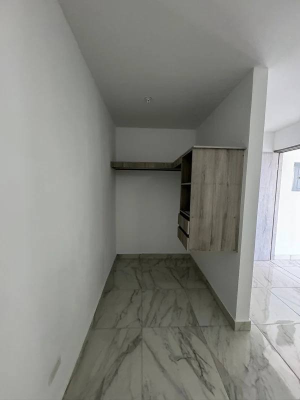 Modern bathroom with marble tile, glass shower, vanity at PH The Gray Panama City