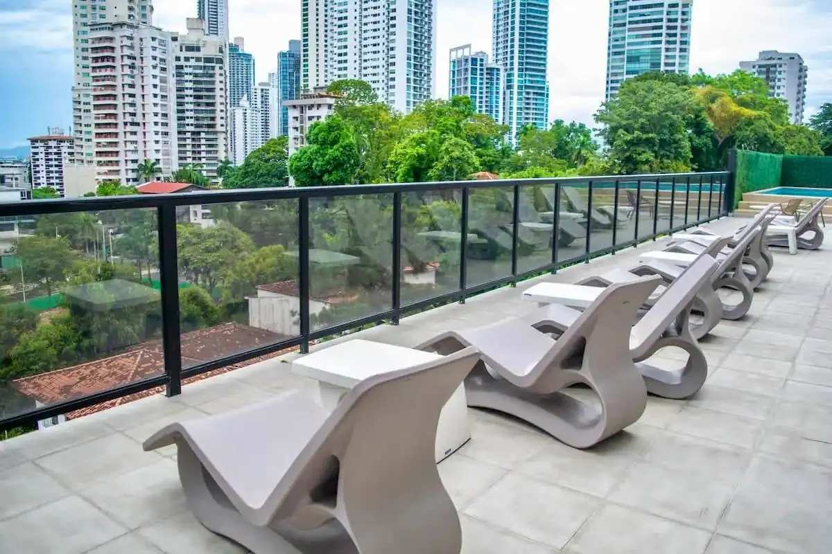 Rooftop terrace lounge area with city skyline view PH The Gray Calle 50 Panama