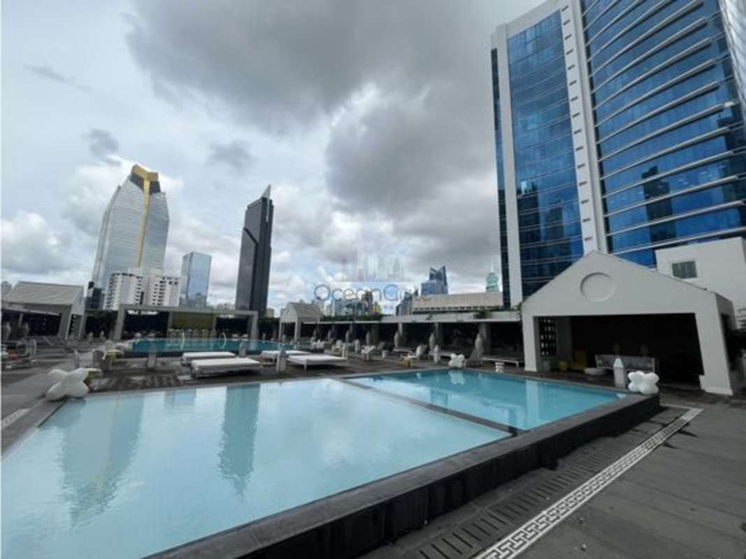 Modern bathroom with marble vanity and walk-in shower in PH Yoo Panama