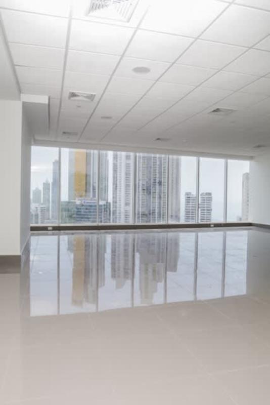 Elevator lobby with marble walls and geometric ceiling design Evolution Tower Panama