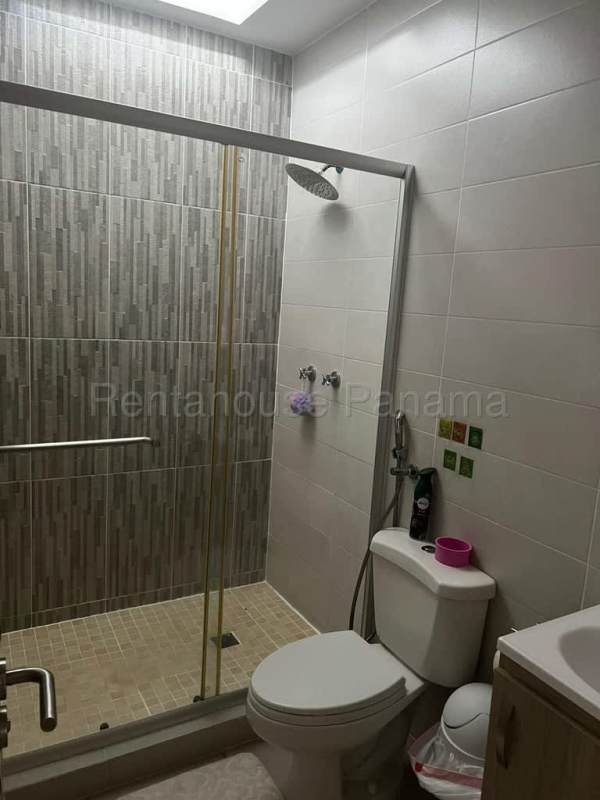 Modern bathroom with shower enclosure and sink duplex rental Brisas del Golf Panama