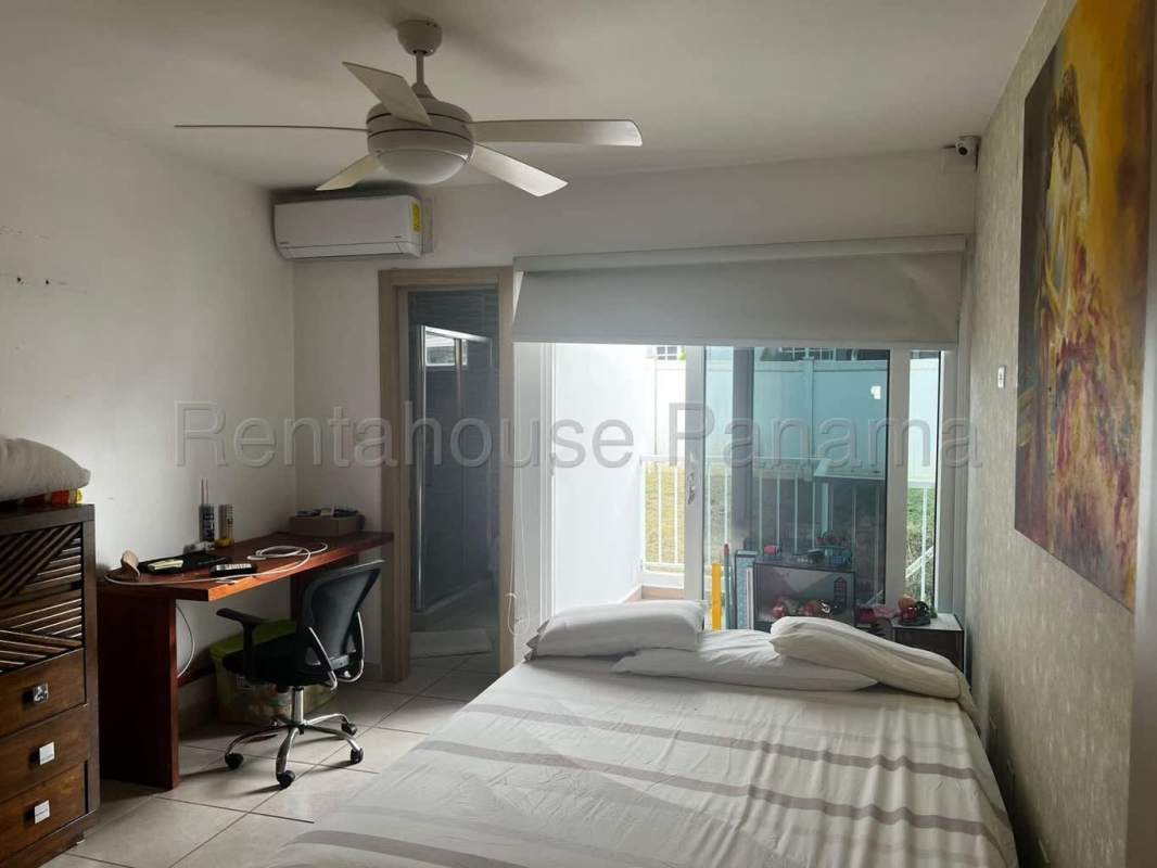 Outdoor pool area surrounded by gardens and lounge areas Brisas del Golf Panama