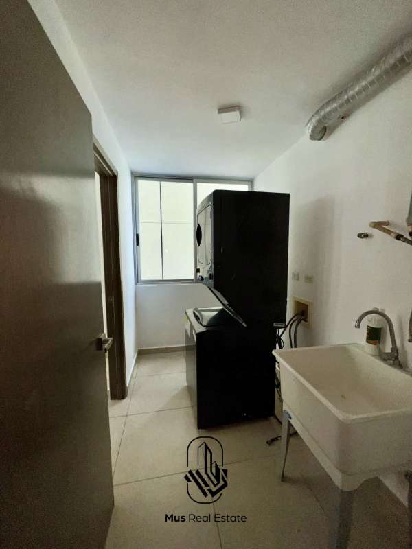 Covered balcony with glass railing and stunning ocean & skyline views at PH Bayside Costa del Este