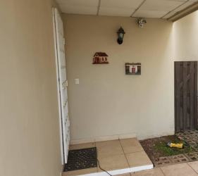 Large backyard lawn with trees and security fence in Cluster Los Olivos Arboledas La Chorrera Panama