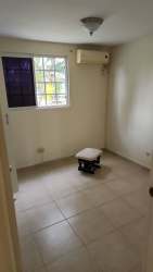 Dining space open to kitchen with ceiling fan and AC in Cluster Los Olivos La Chorrera Panama