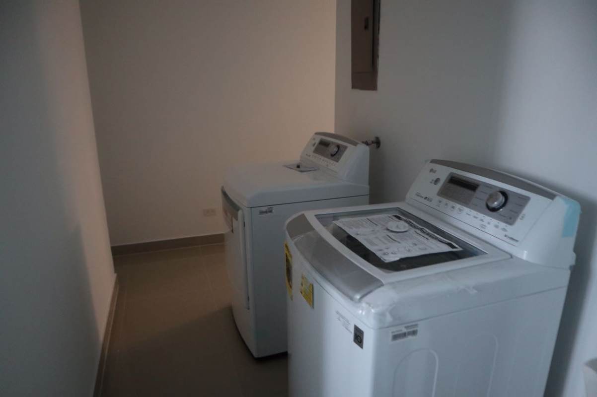 Open kitchen featuring granite counters, gas stove, stainless fridge PH Costa del Este Panama