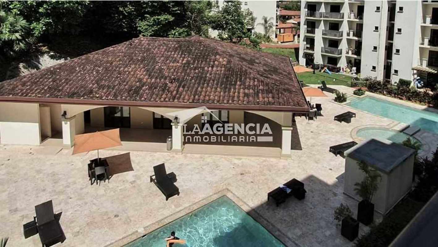 Aerial showing pool, sun loungers, clubhouse at Embassy Village Panama