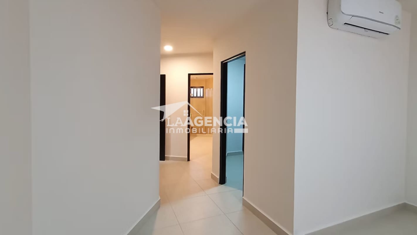 Bedroom with sliding door to balcony overlooking greenery Embassy Village Panama
