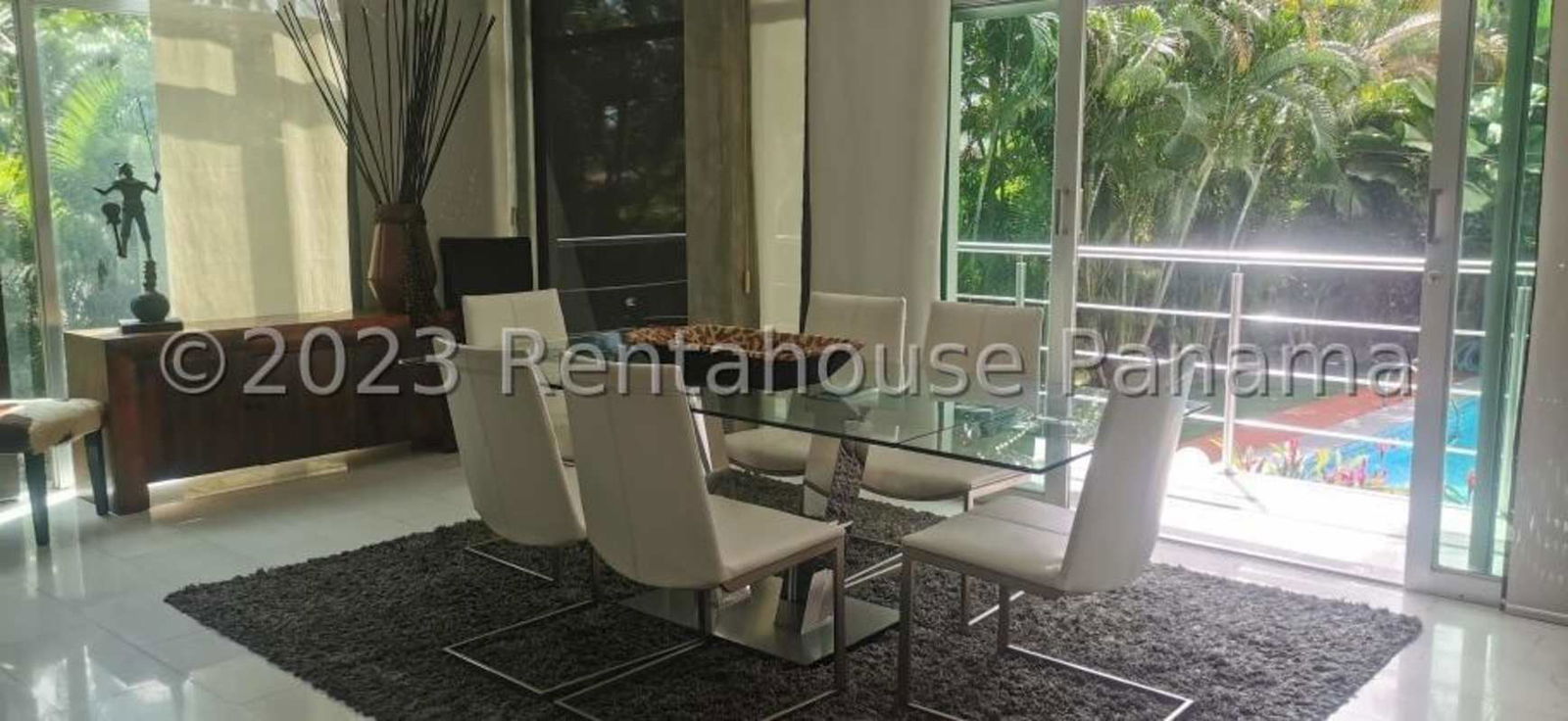 Modern living room with natural light, large sofa, TV area in Albrook Panama City rental