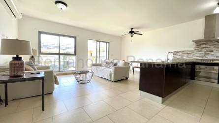 Kitchen with granite countertops and dark cabinets at PH Woodlands Panama Pacifico