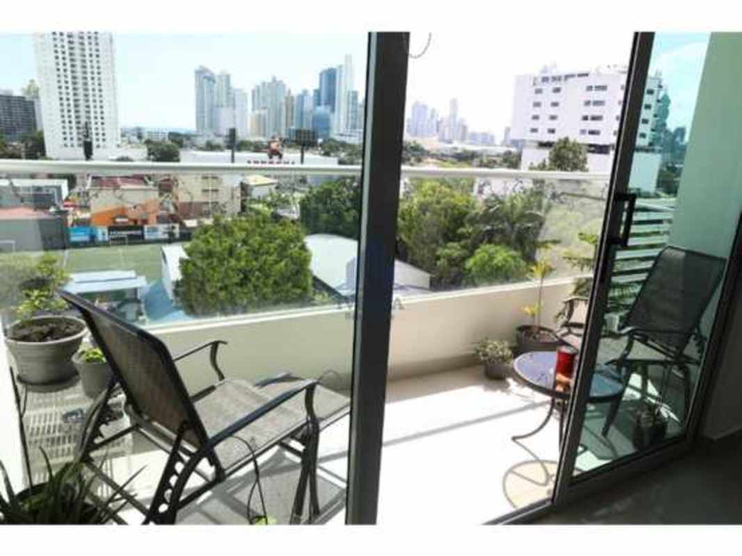 Private balcony with potted plants, sitting area, skyline city view PH San Francisco Panama