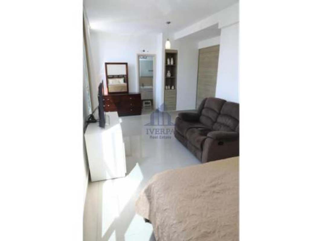 Rooftop pool with lounge chairs skyline city views PH San Francisco Panama