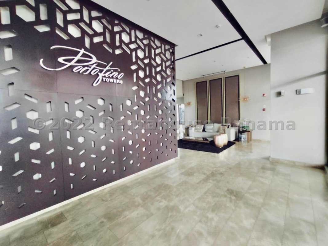 Open living and dining area with modern kitchen in PH Portofino Towers