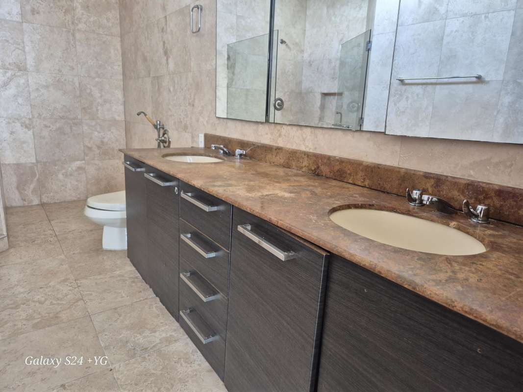 Guest half bathroom with pedestal sink and beige tile PH Panama Bay Costa del Este