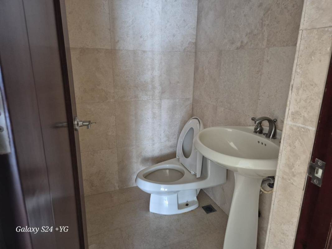 Elegant bathroom with marble countertops, double vanity, glass shower PH Panama Bay Costa del Este