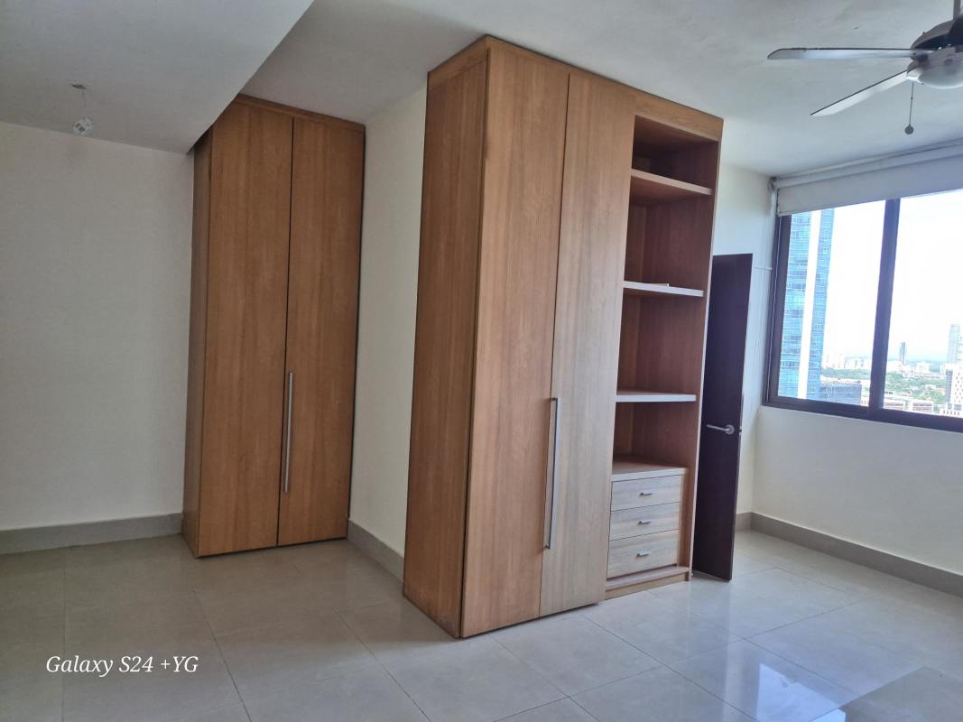 Bedroom with built-in closets tile floor and large window PH Panama Bay Costa del Este