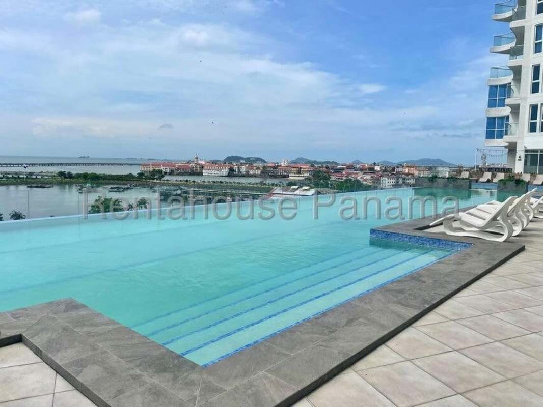 Infinity pool with panoramic city and ocean views at PH BICSA Panama City